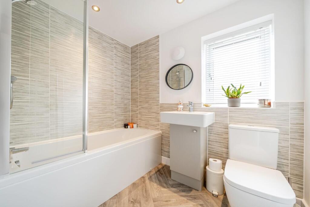 BATHROOM with SHOWER over bath.jpg