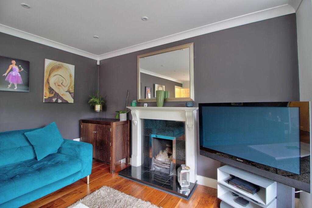 Cosy fire &amp; walnut flooring