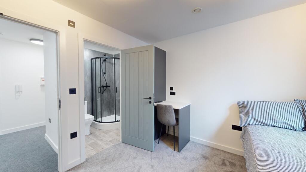 A bright and spacious double bedroom featuring ...