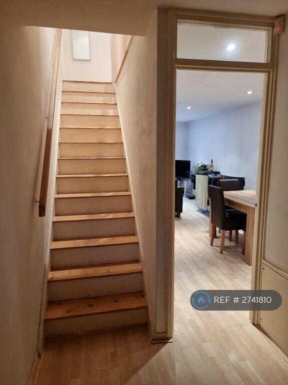 View From Entrance To Stairs And Dining Area