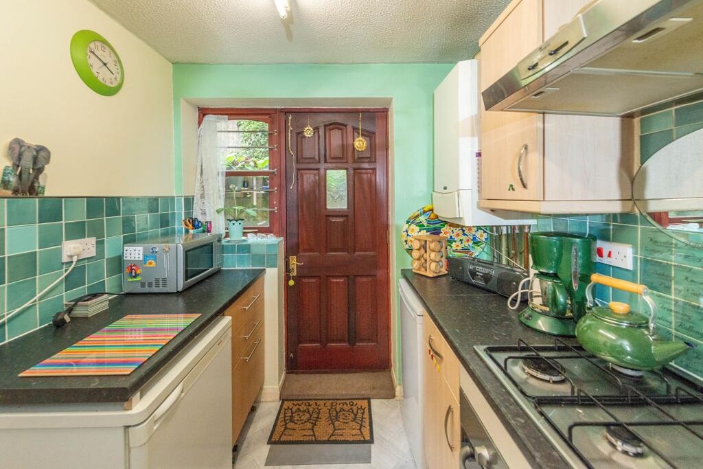 SITTING ROOM DINING AREA AND KITCHEN