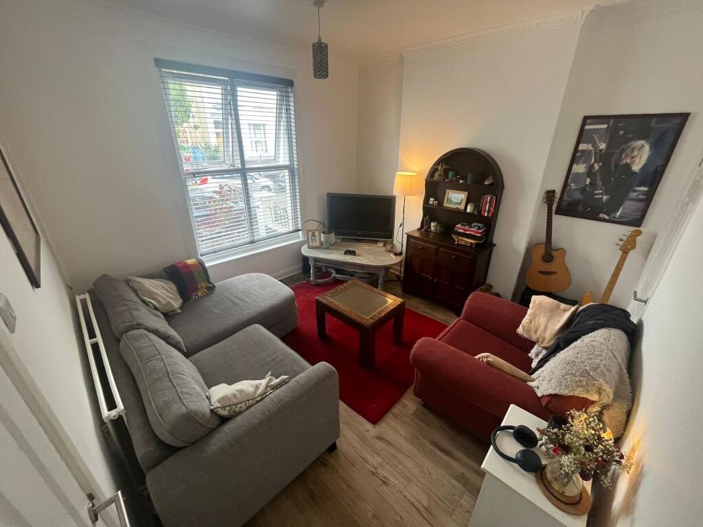 A cozy living room featuring comfortable seatin...