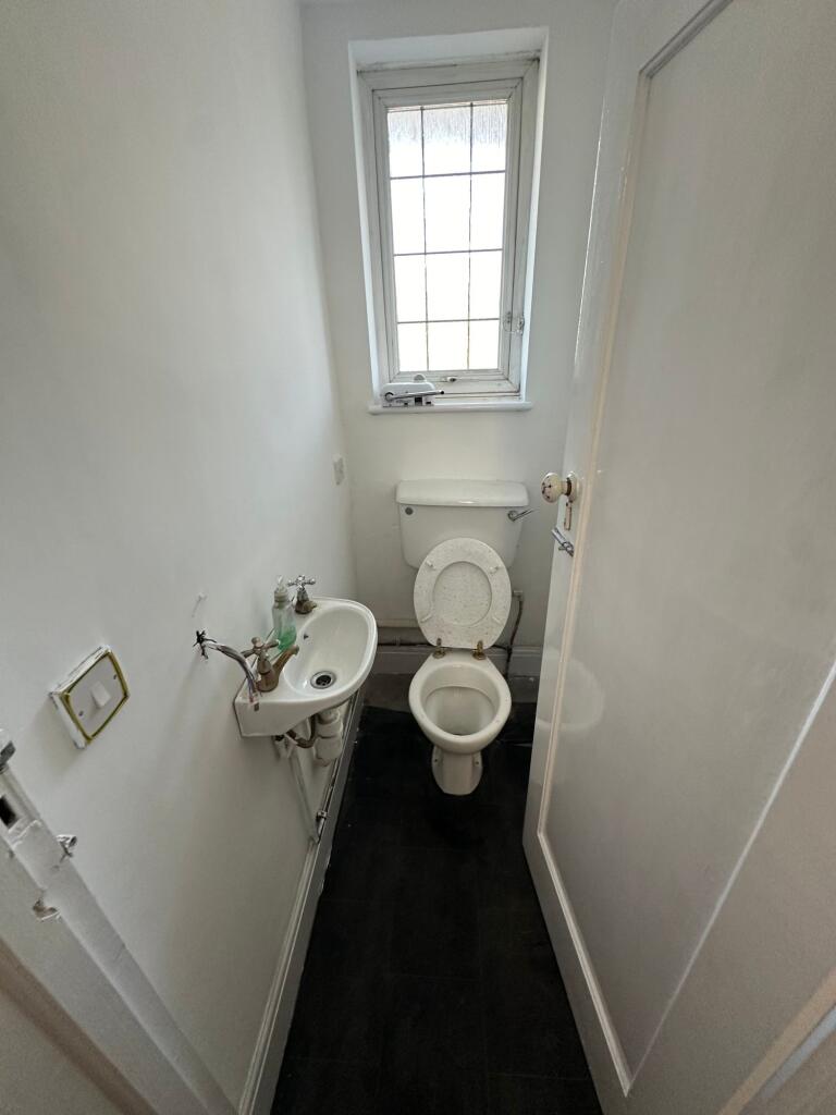 Compact and functional toilet room featuring a ...