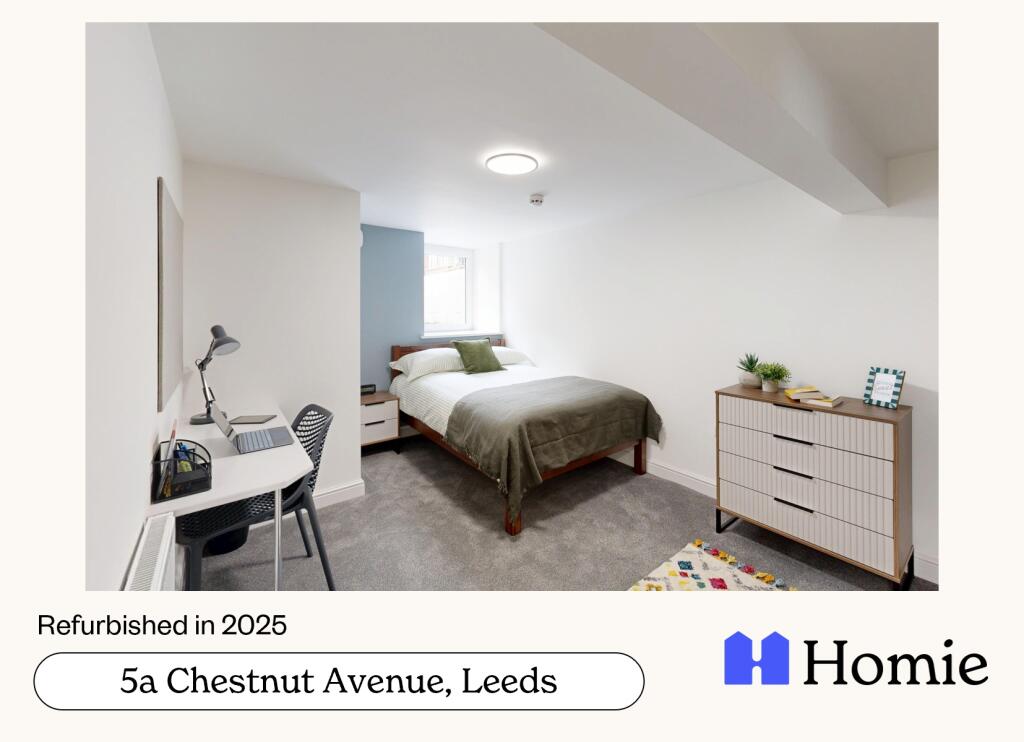 A spacious, well-lit master bedroom featuring a...