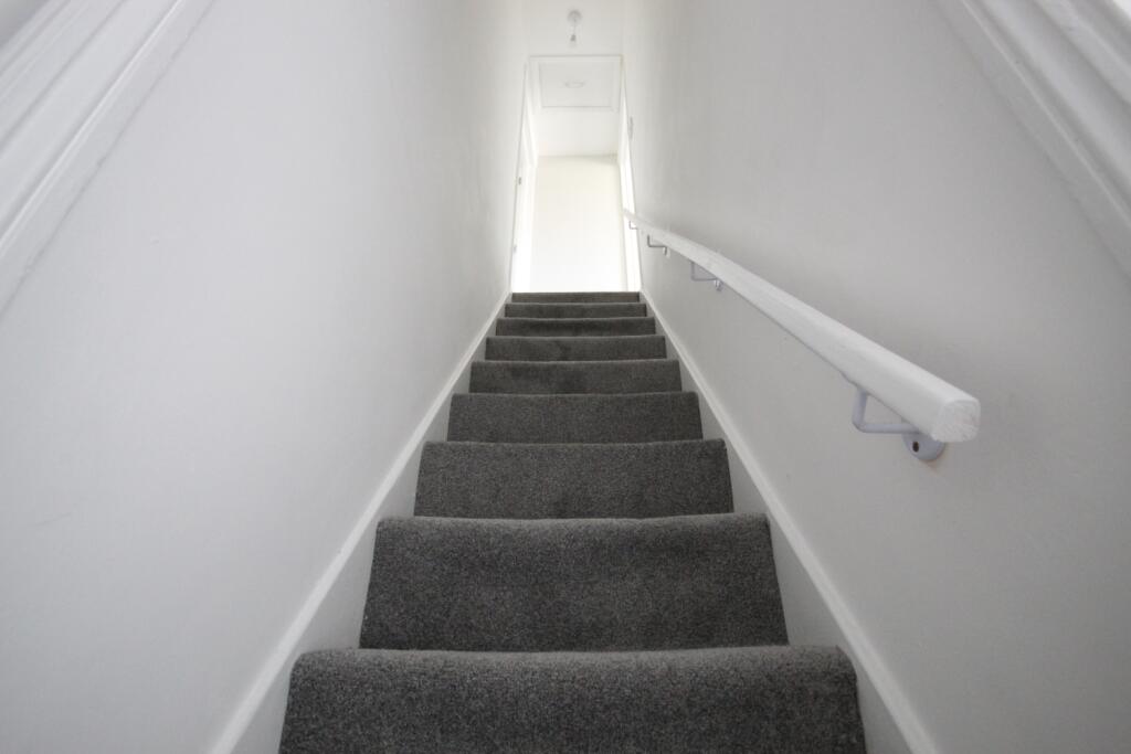 Stairs leading to bedrooms 