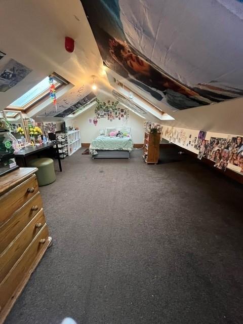 Bright and welcoming bedroom with a comfortable...