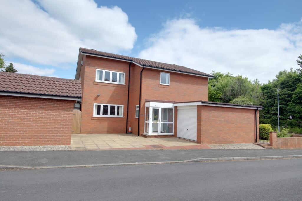 Taken from Magdelene Court, showing both garages