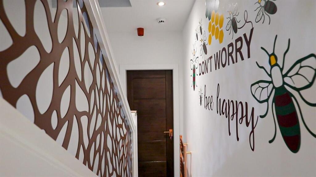 Bright and clean hallway with charming decorati...