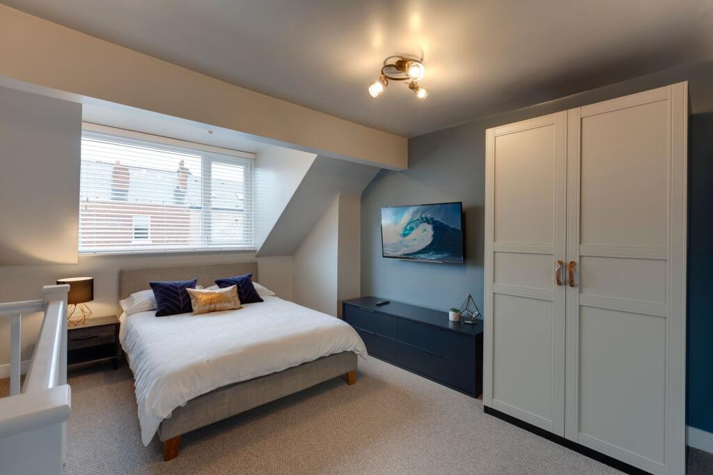 Bright and inviting master bedroom featuring a ...