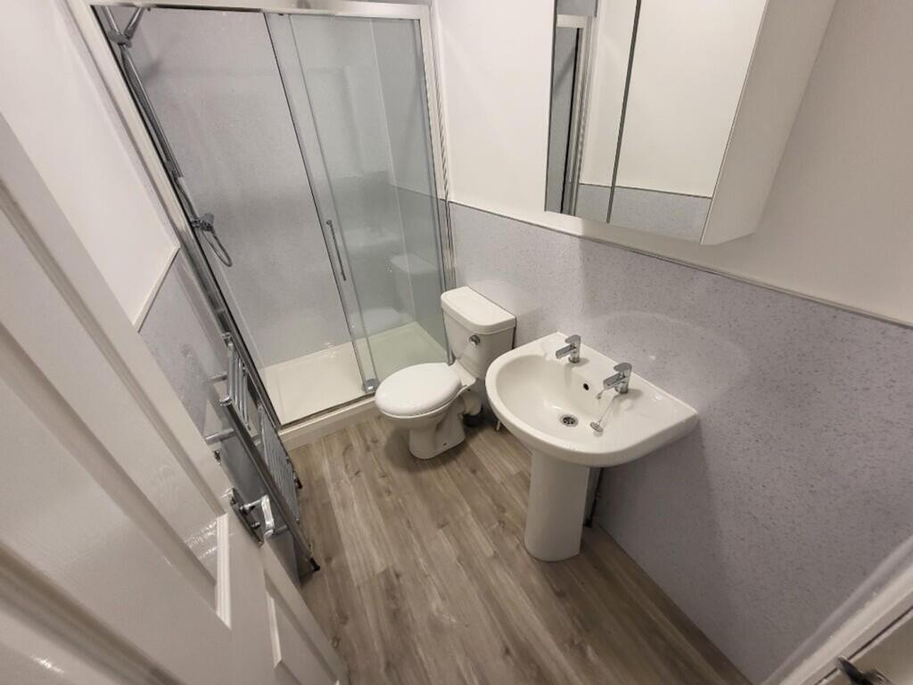 A modern and stylish bathroom featuring a sleek...