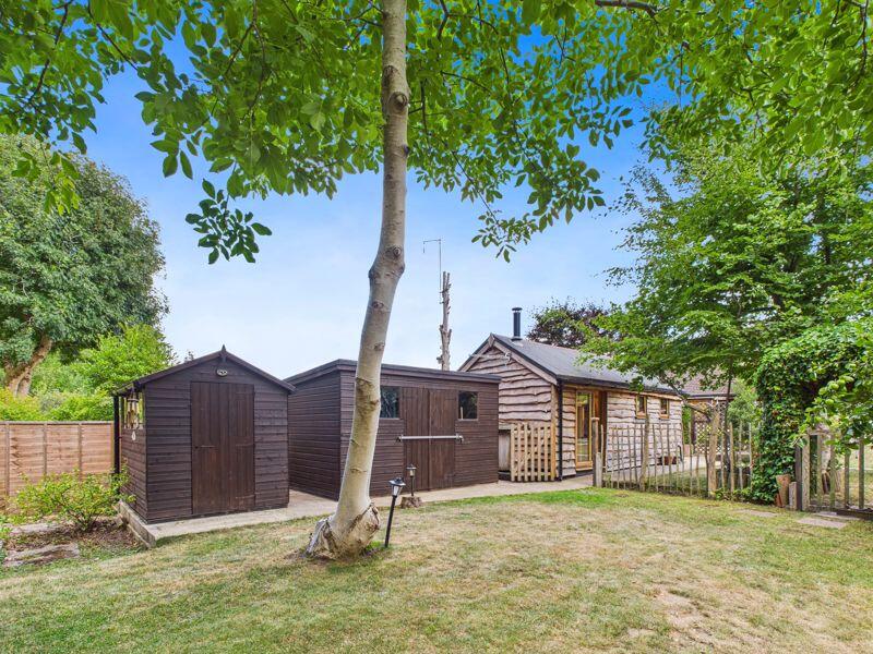 REAR GARDEN WITH TWO SHEDS