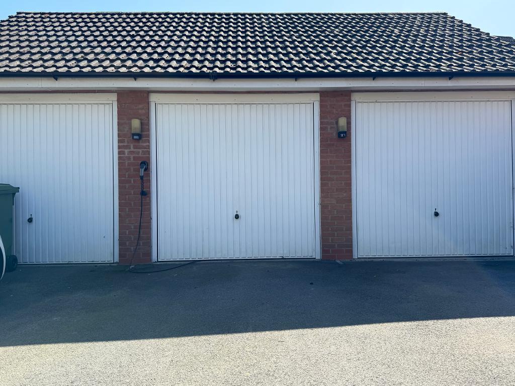 Middle garage accessed via garden