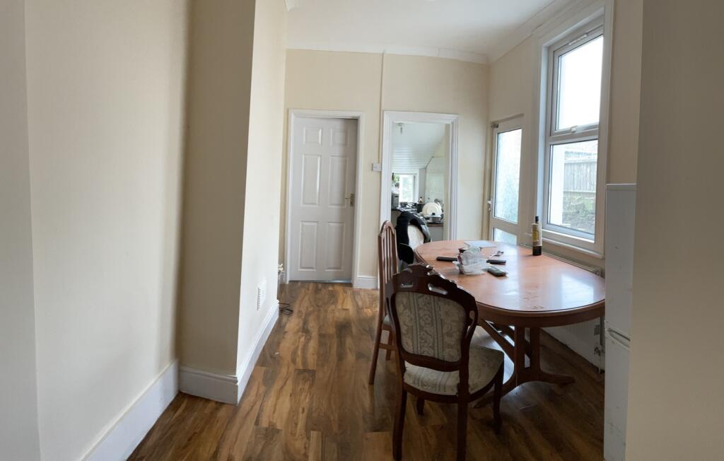 A bright and inviting kitchenette with a dining...