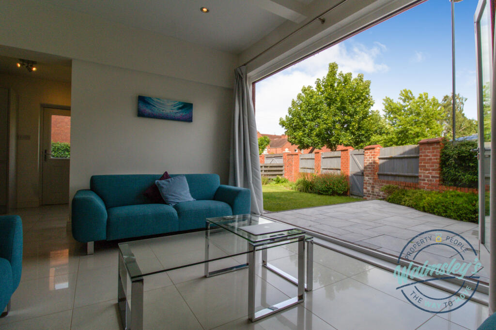 Bi-folding doors off family room