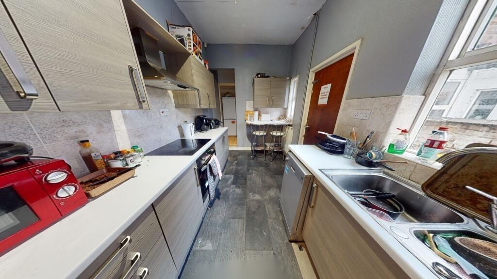 Bright and modern kitchen space featuring ample...