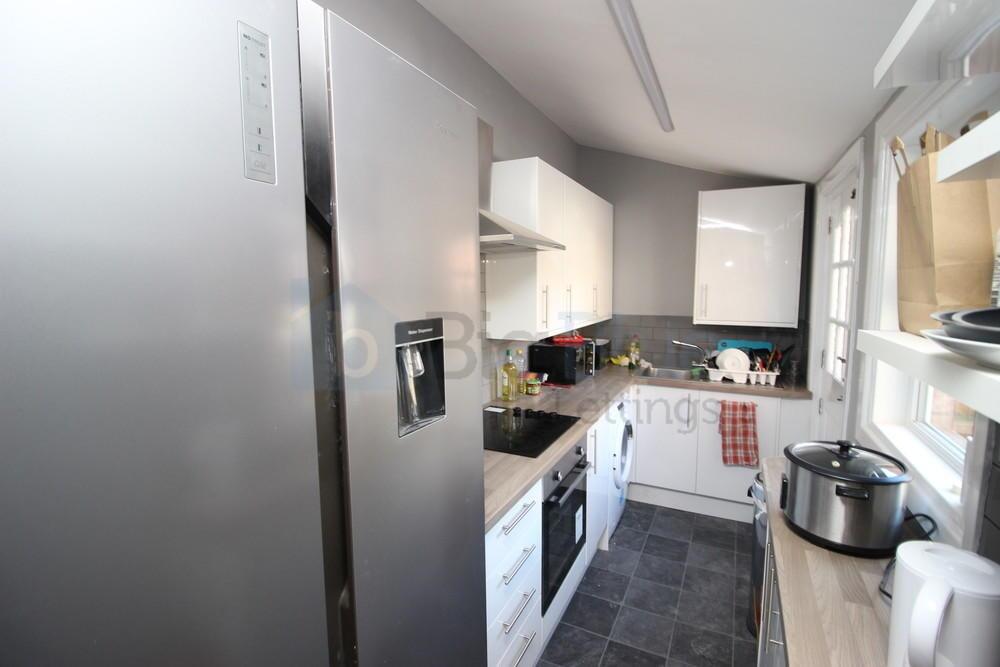 Modern kitchen with ample countertop space, int...