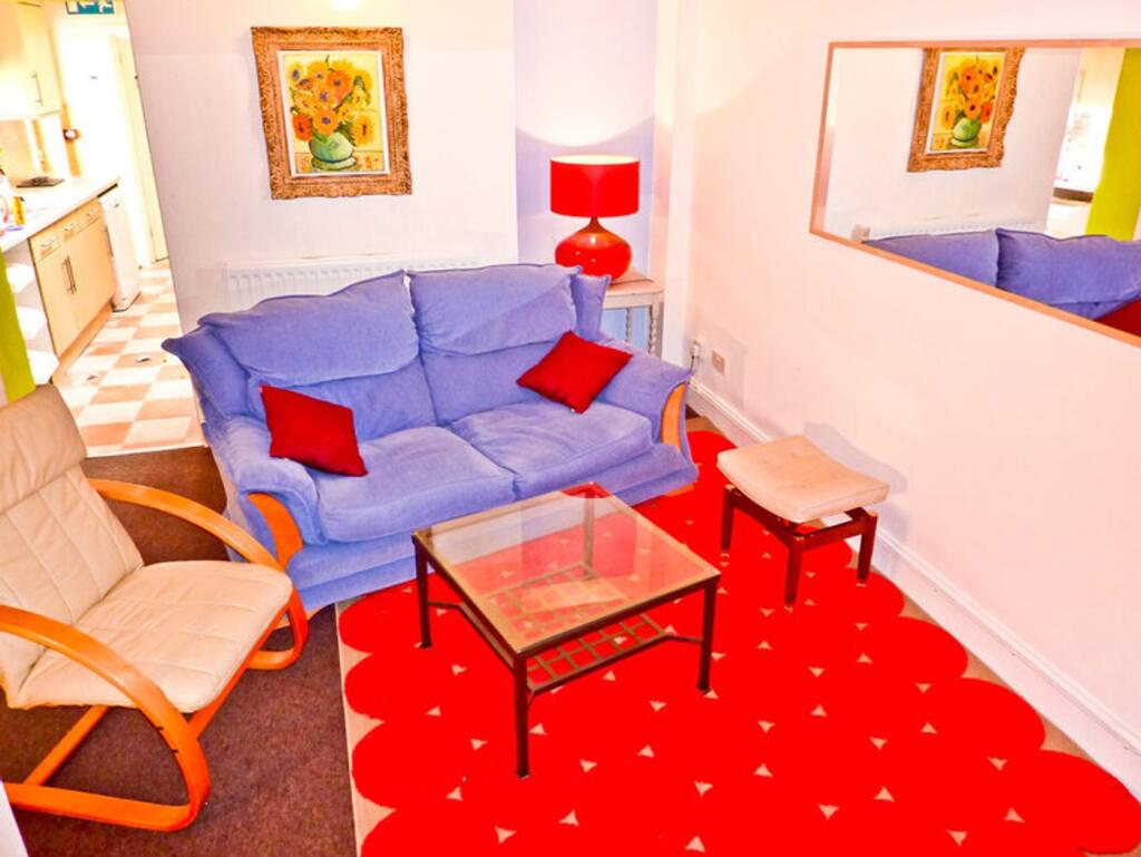 A cozy and inviting living room featuring comfo...