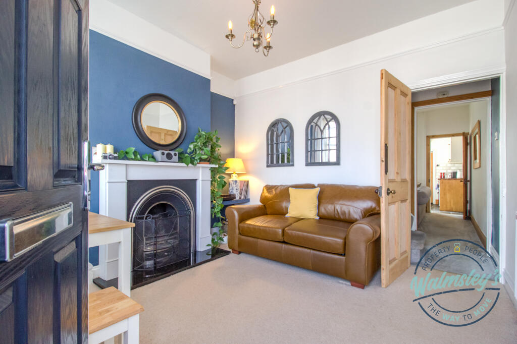 Sitting room through to rear reception