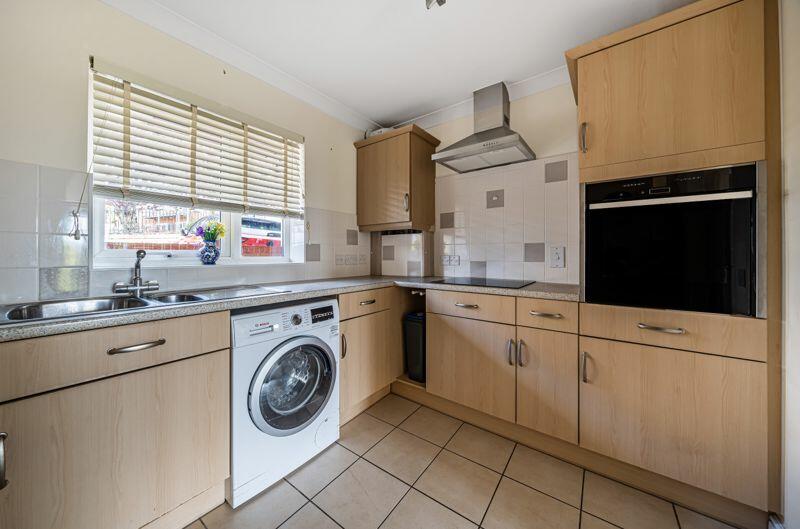 Kitchen with built-in appliances