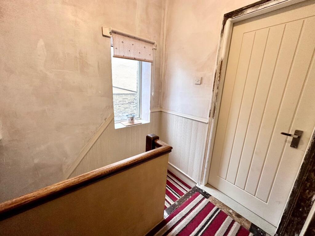 TO THE FIRST FLOOR LANDING