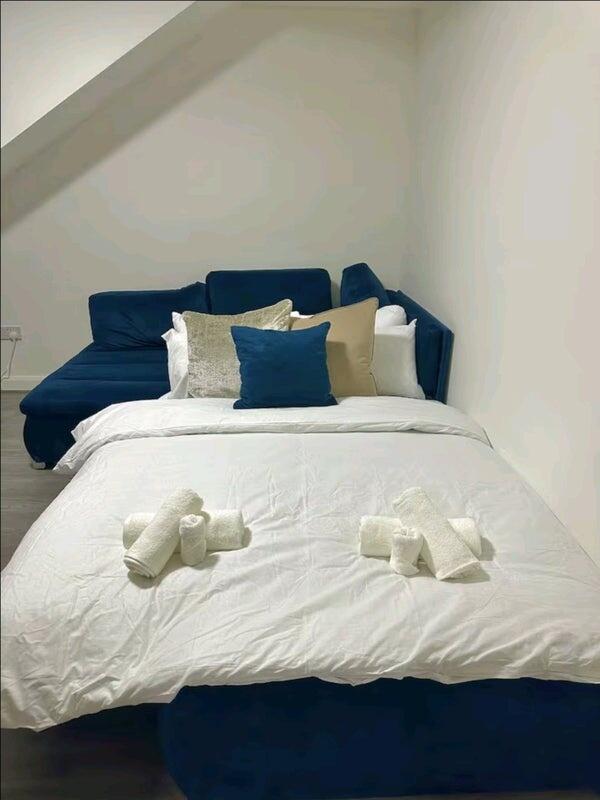 A modern double bedroom featuring a neatly made...