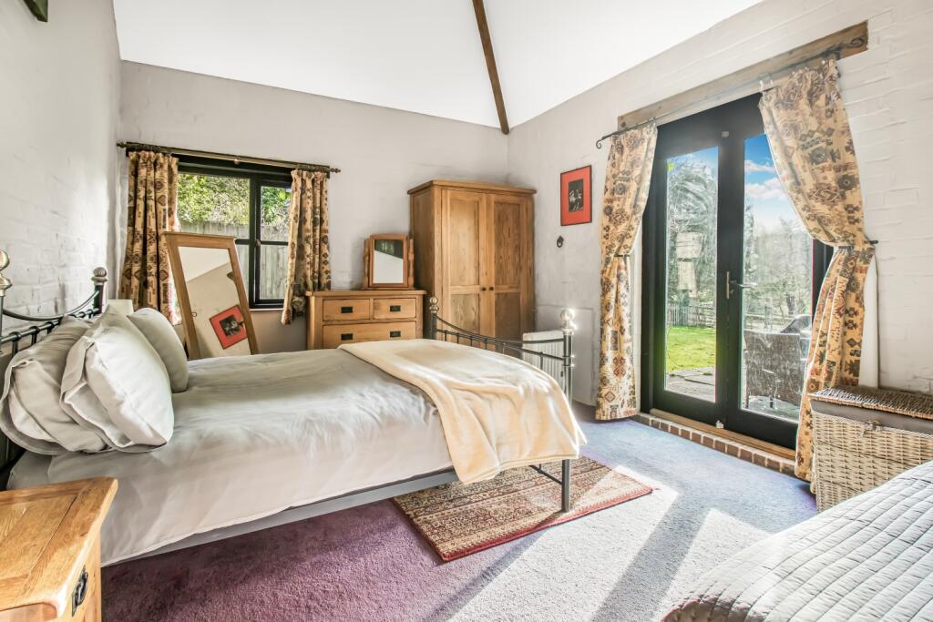 bedroom with patio doors