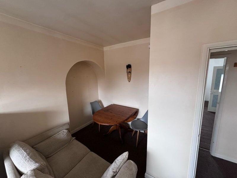 Cozy living room featuring a comfortable sofa a...