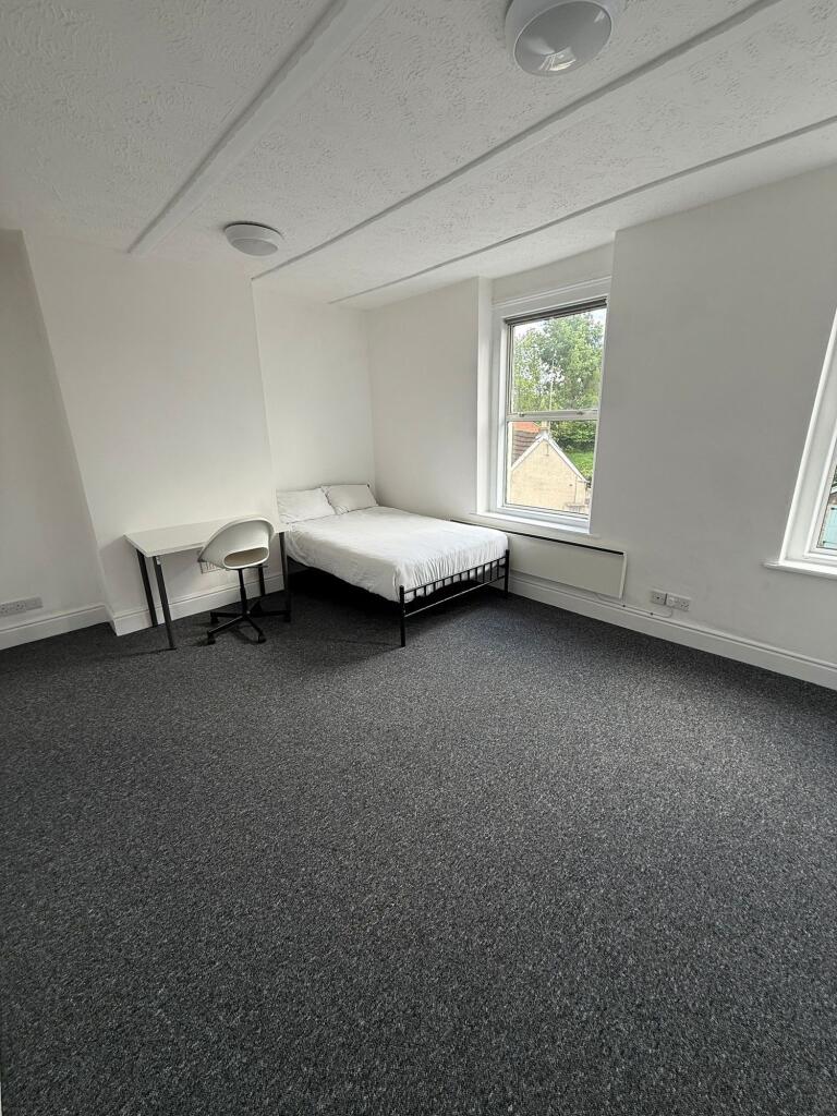 Bright and inviting double bedroom featuring am...