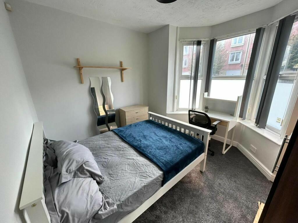 Bright and inviting double bedroom featuring a ...