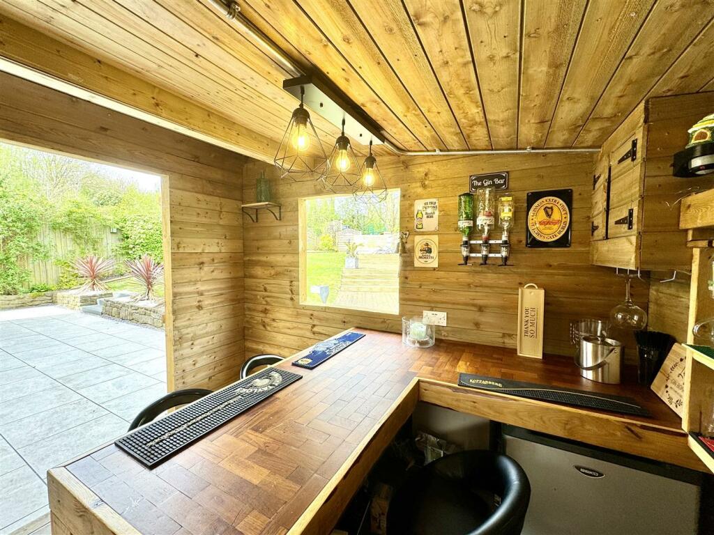 OUTSIDE HOME OFFICE/BAR/HOBBY ROOM