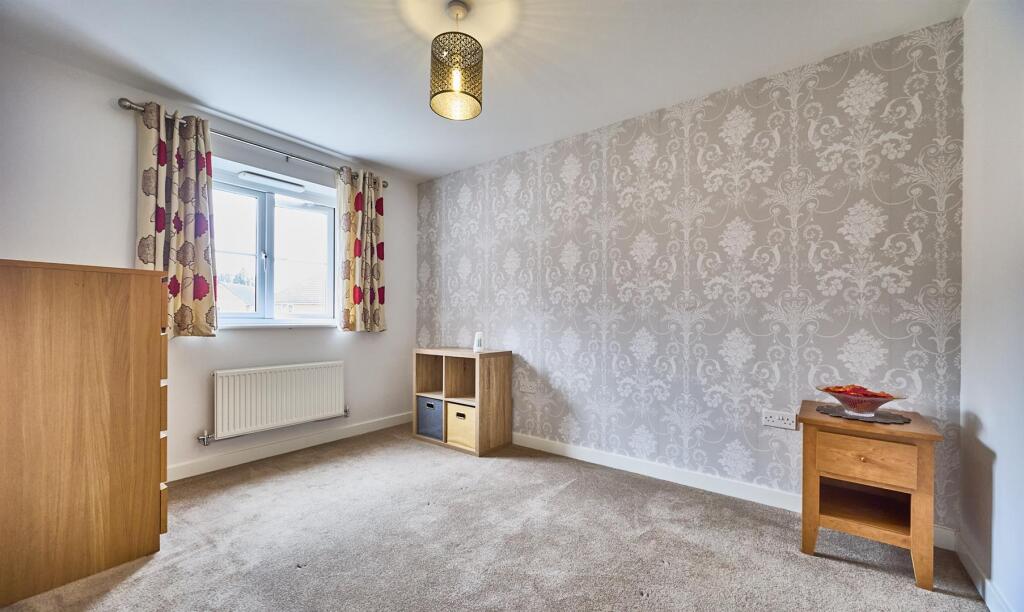 BEDROOM ONE TO REAR