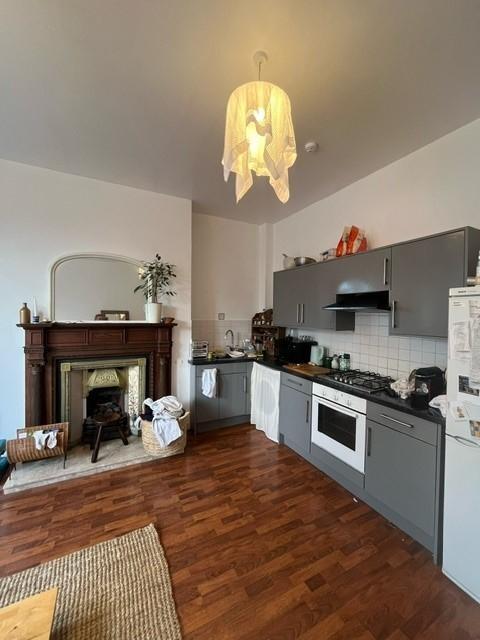 Modern kitchen area with ample counter space, f...