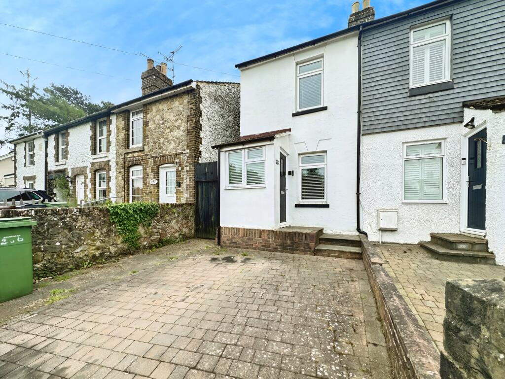 Front View Of The Property With Driveway Parking