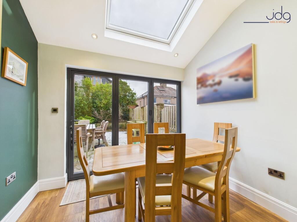 Open Plan Kitchen Diner with skylight and bi-fold doors