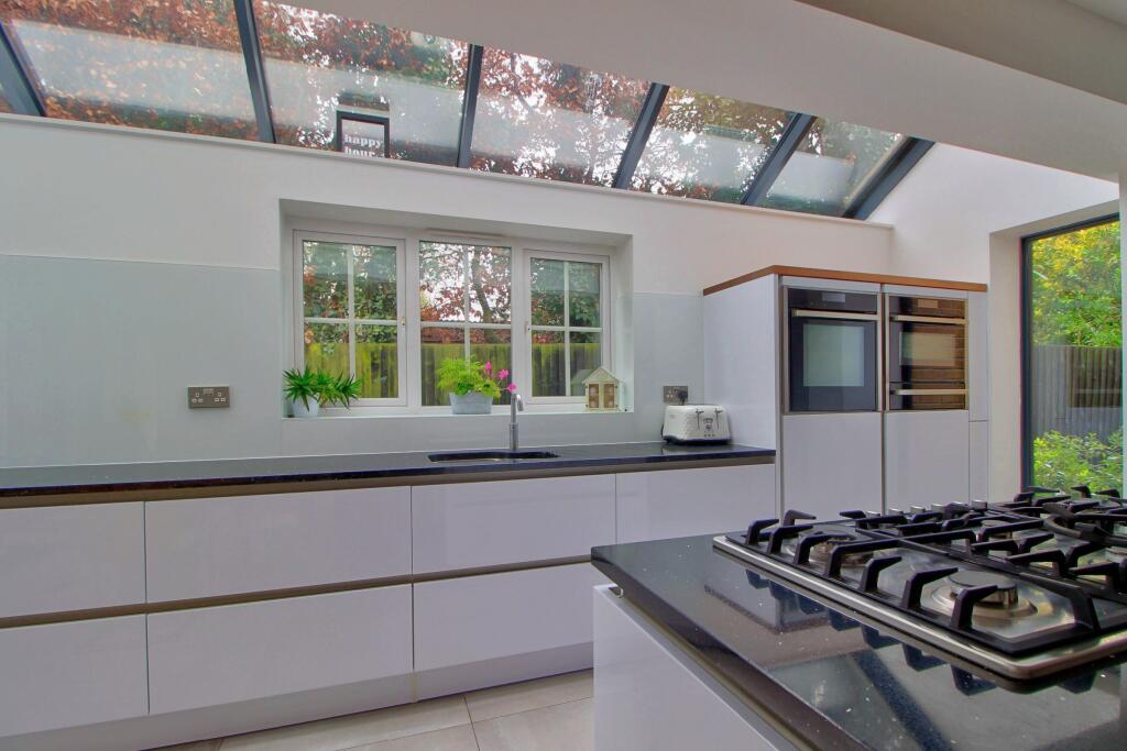 Five burner hob and eye-level ovens