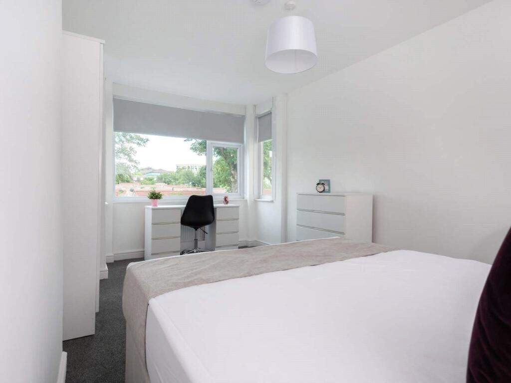 Bright and inviting double bedroom featuring a ...