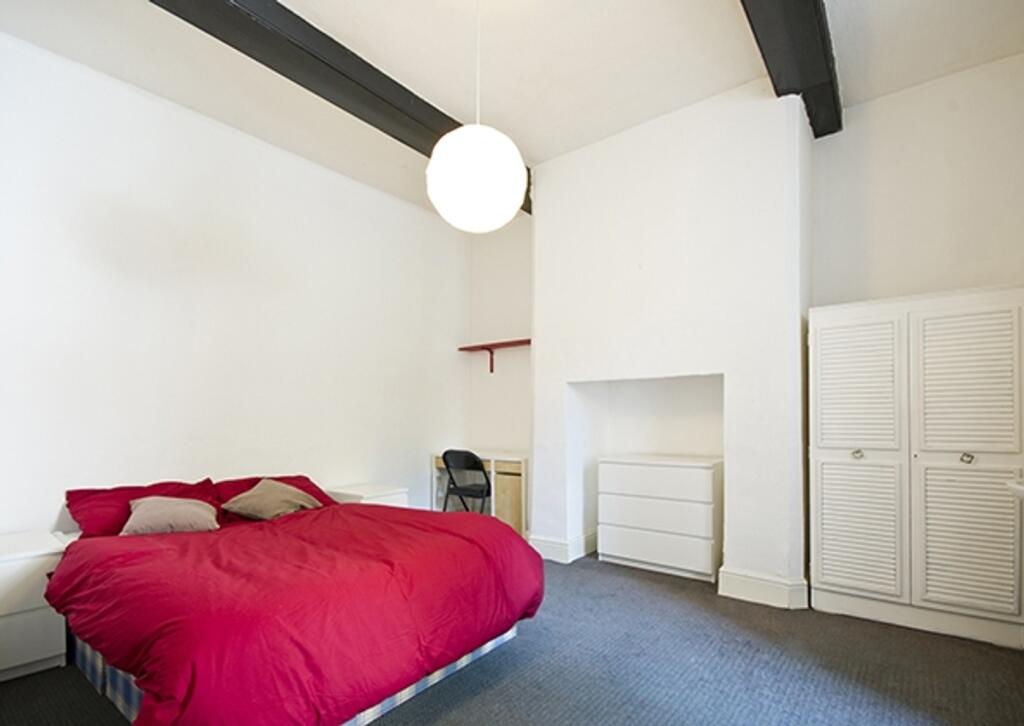 A spacious and inviting double bedroom featurin...