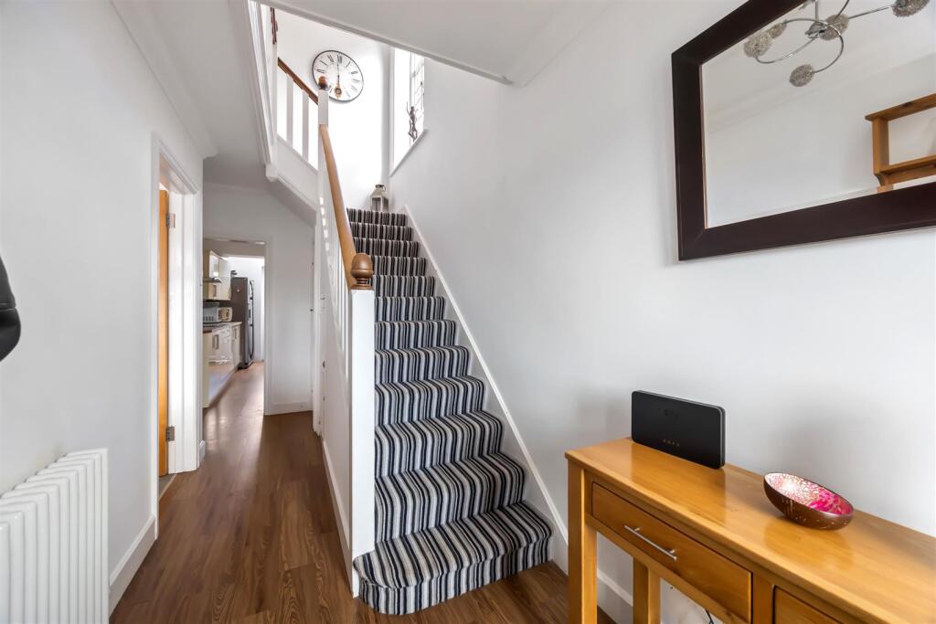 Stairs rising to First Floor