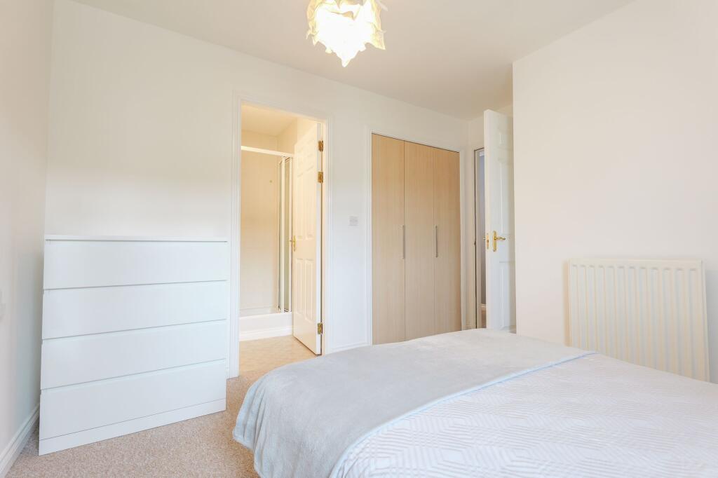Double bedroom features private ensuite shower room