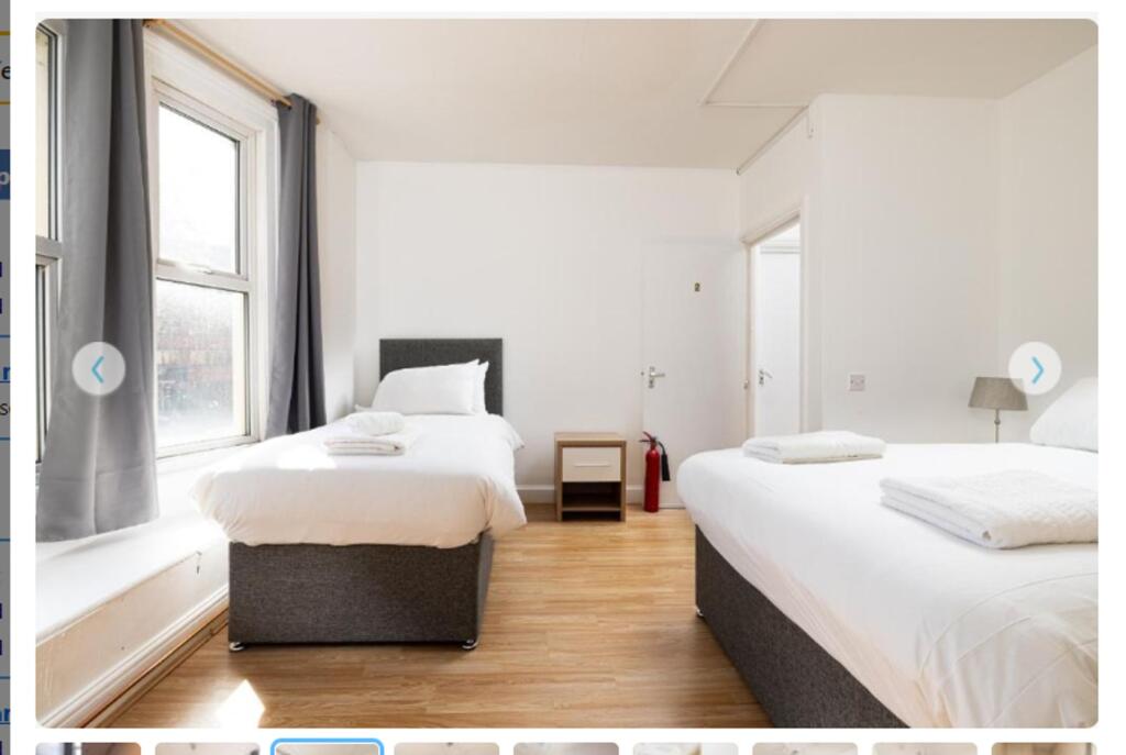 A bright and spacious double bedroom featuring ...