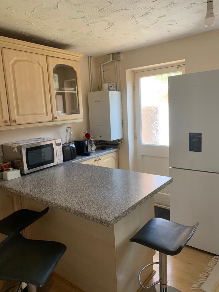 A bright and spacious kitchen featuring modern ...