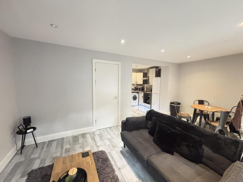 A bright and spacious living room with modern d...