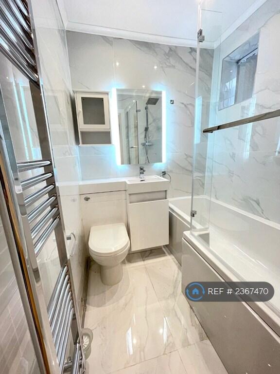 Bathroom With Bath And Shower Over 