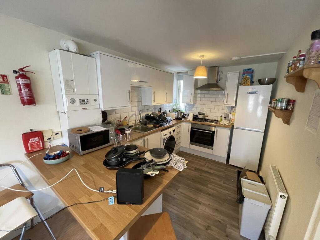 Bright and practical kitchen featuring modern w...