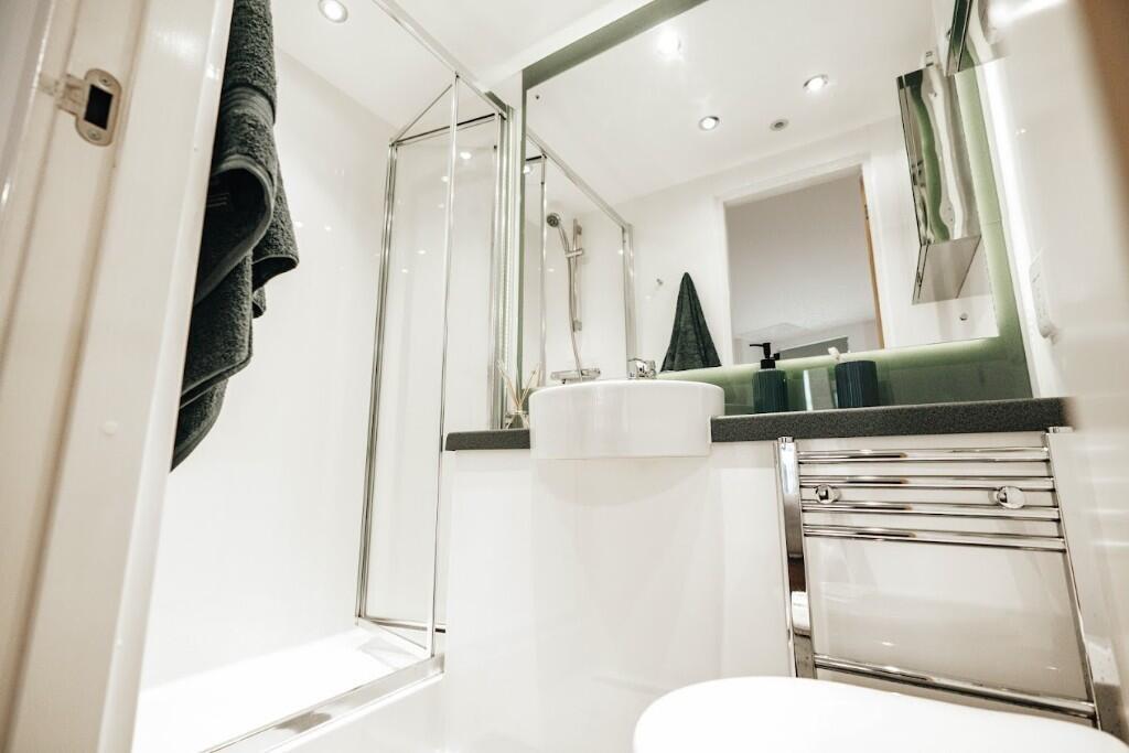 A modern and well-maintained bathroom featuring...