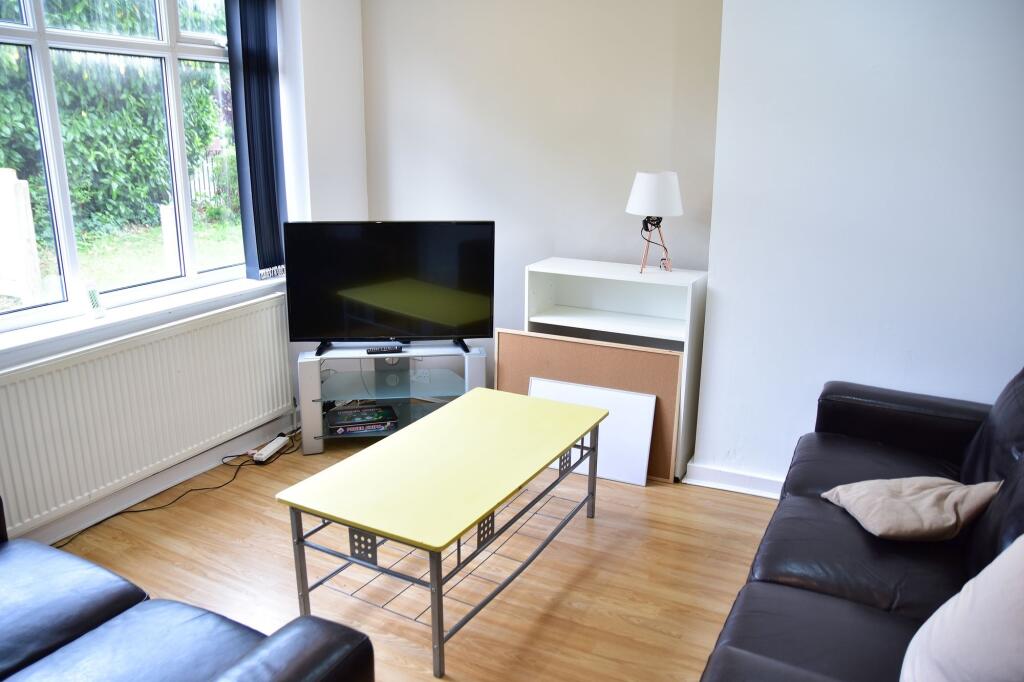 Bright and welcoming living room featuring a la...