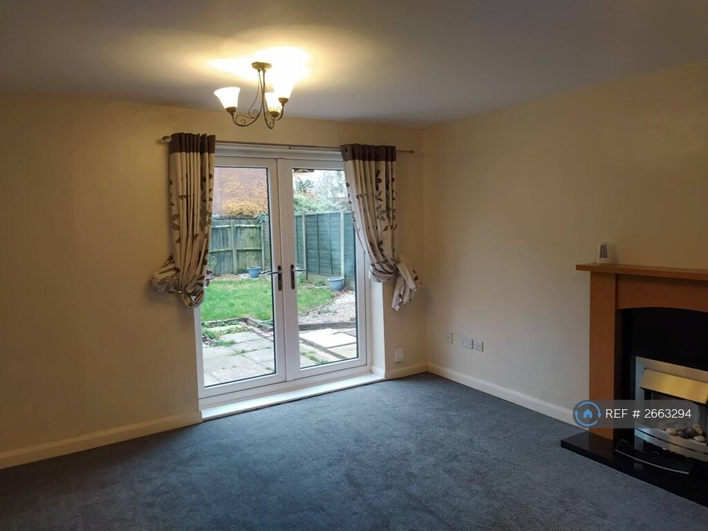 Lounge With French Doors Opening To Garden