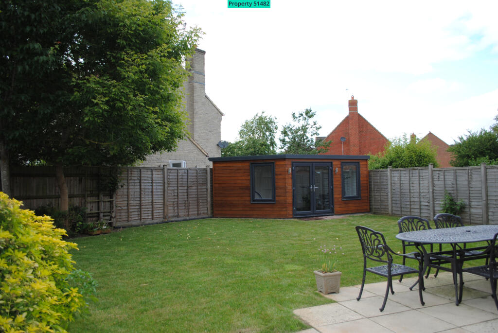 Rear garden showing gym/office