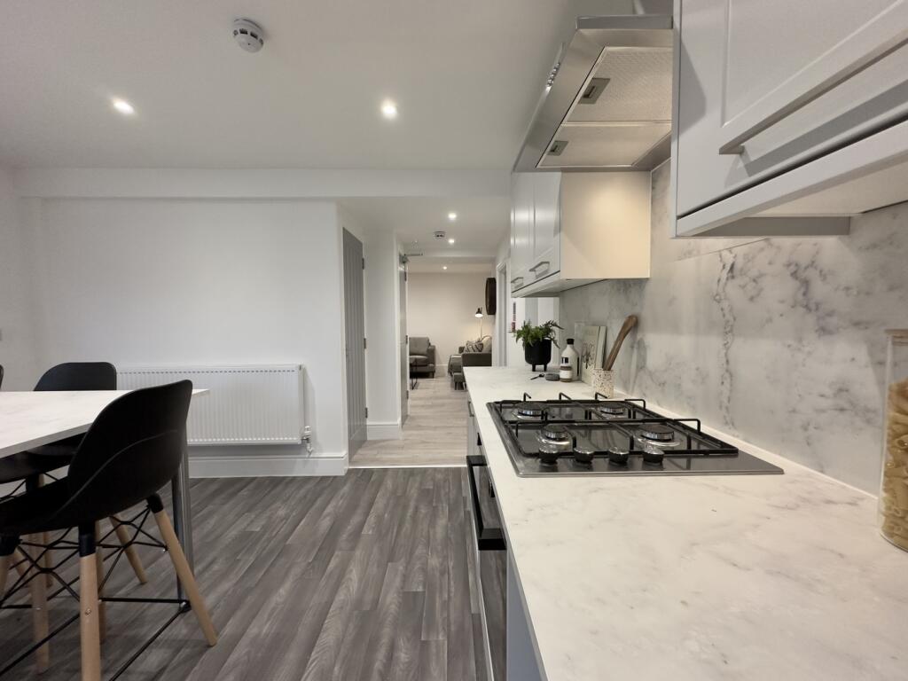 A modern and clean kitchenette featuring stylis...