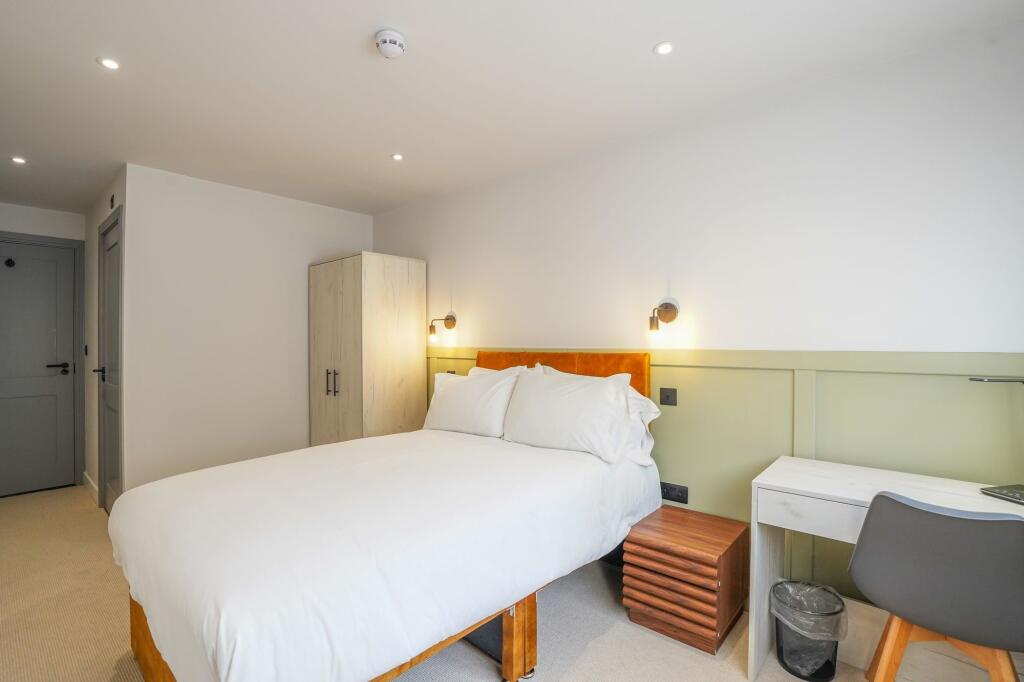 Bright and inviting double bedroom featuring a ...